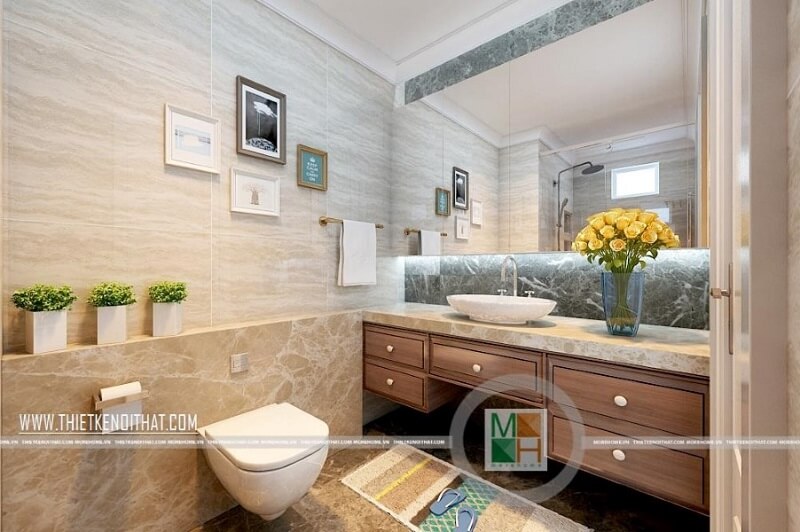 Thiết kế phòng tắm chung cư đẹp với trang thiết bị vệ sinh cao cấp kết hợp kệ tủ gỗ màu óc chó mang đến sự sang trọng và tinh tế. Mẫu thiết kế nội thất chung cư đẹp